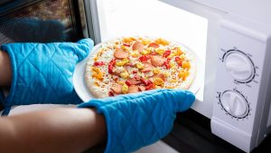 food being cooked in microwave with new lightbulb
